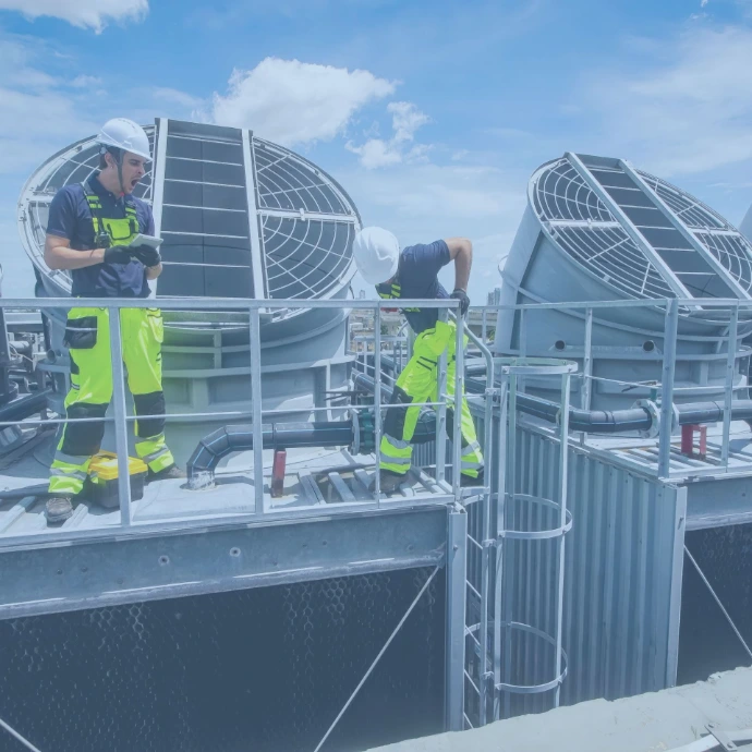 Facility maintenance technician inspecting and servicing building systems to ensure operational safety and performance.