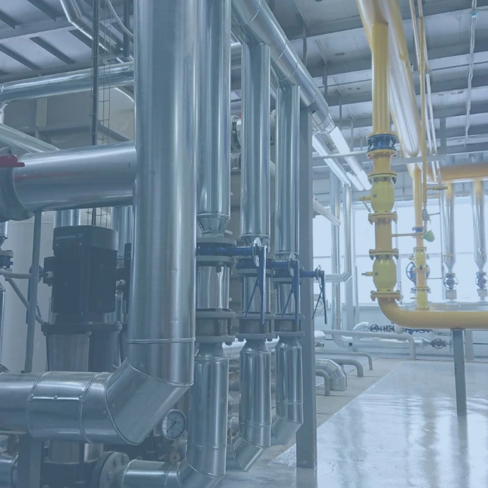 Mechanical, electrical, and plumbing systems being installed in a commercial construction project, highlighting integrated building infrastructure.