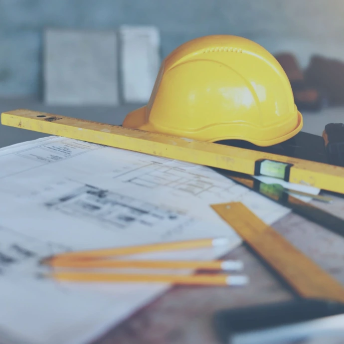 Professional building maintenance services with a technician inspecting and servicing mechanical and electrical systems to ensure safe operation, efficiency, and long-term facility performance.