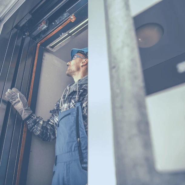 Professional building maintenance services with a technician inspecting and servicing mechanical and electrical systems to ensure safe operation, efficiency, and long-term facility performance.